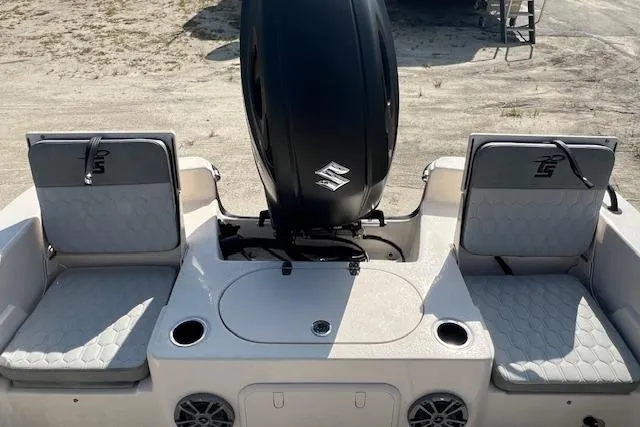 Slide: The Image of 2026 Carolina Skiff 23 LS boat interior with seating and outboard motor. - 2