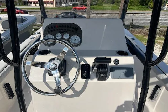 Slide: The Image of 2026 Carolina Skiff 23 LS boat dashboard with steering wheel and control panel. - 5