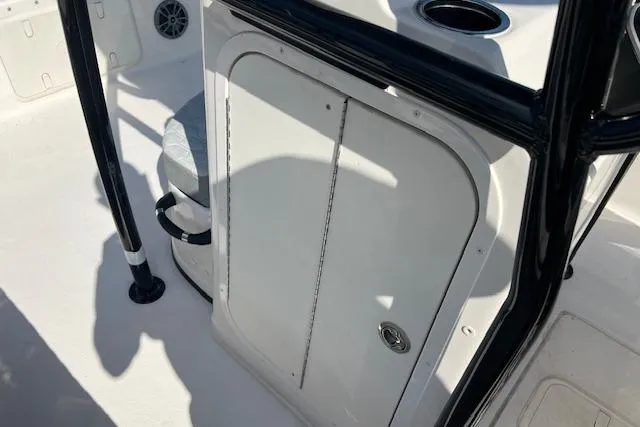 Slide: The Image of 2026 Carolina Skiff 23 LS boat interior with storage compartment and seating. - 6