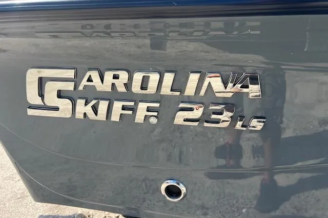 Slide: The Image of 2026 Carolina Skiff 23 LS logo on boat hull, metallic lettering. - 9