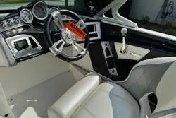 Slide: The Image of 2014 MasterCraft X10 boat interior with modern dashboard and steering wheel. - 11
