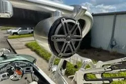 Slide: The Image of 2014 MasterCraft X10 boat with mounted speaker and wakeboard rack. - 12