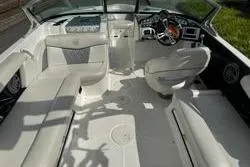 Slide: The Image of 2014 MasterCraft X10 boat interior with white seating and modern dashboard. - 7