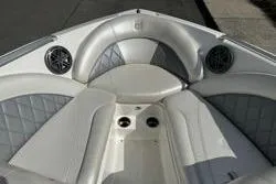 Slide: The Image of 2014 MasterCraft X10 boat interior with white seating and built-in speakers. - 8