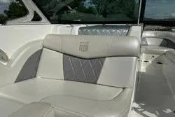 Slide: The Image of 2014 MasterCraft X10 boat interior with white and gray seating. - 9