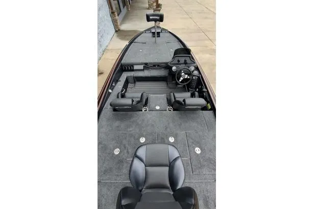 Slide: The Image of 2026 Phoenix 721zxl boat interior with steering wheel and seating, showcasing modern design. - 9