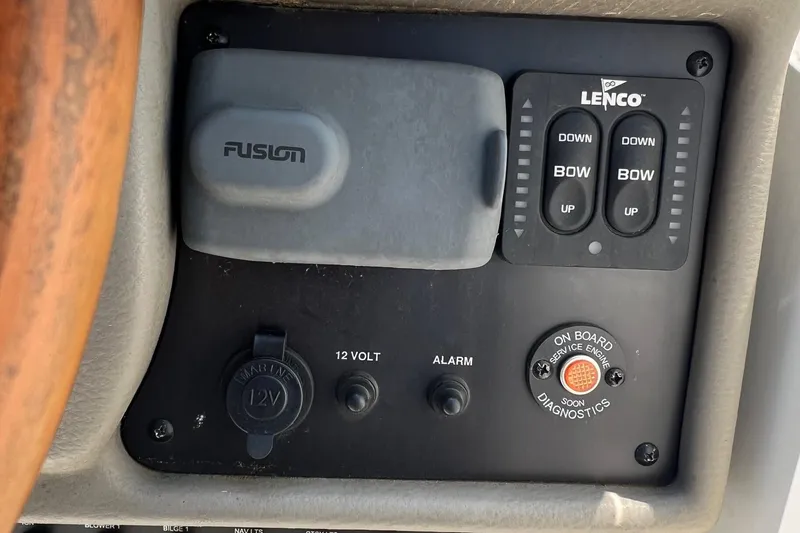Slide: The Image of Control panel of a 2016 Crownline 264 CR boat with Lenco and Fusion systems. - 14