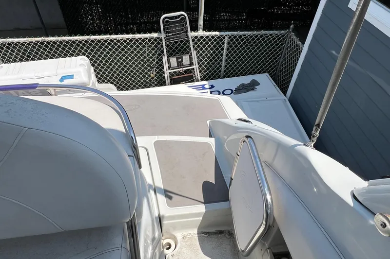 Slide: The Image of 2016 Crownline 264 CR boat deck with seating and storage compartments. - 6