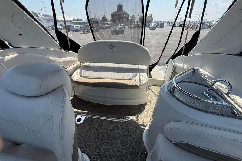 Slide: The Image of Interior of 2016 Crownline 264 CR boat with seating and sink area. - 9