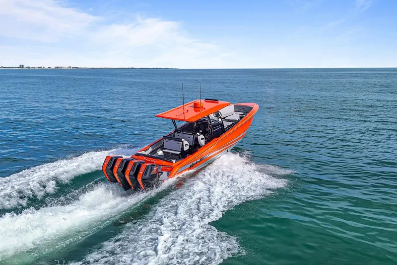 Slide: The Image of 2026 Nor-Tech 390 Sport Center Console boat cruising on open water. - 29