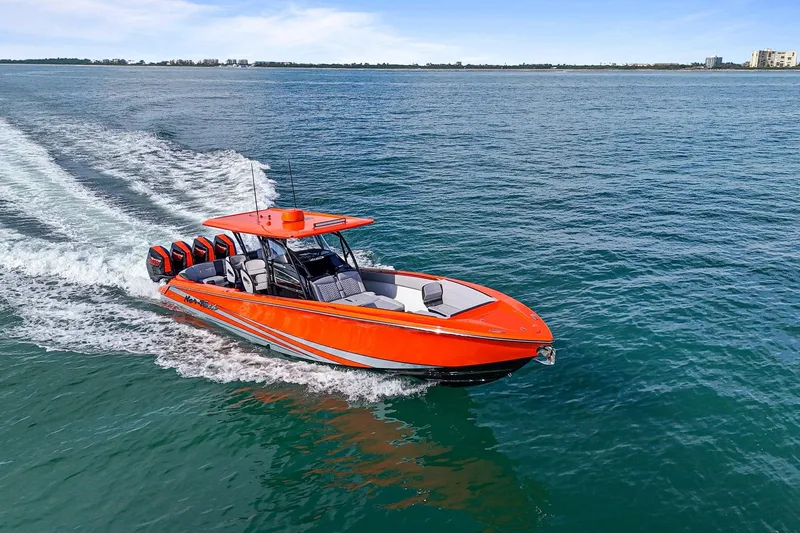 Slide: The Image of 2026 Nor-Tech 390 Sport Center Console boat cruising on open water. - 3