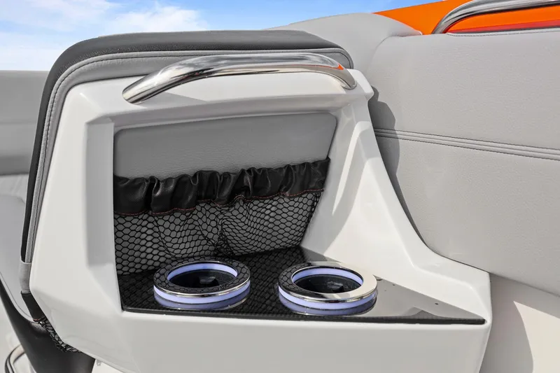 Slide: The Image of 2026 Nor-Tech 390 Sport Center Console interior with cup holders and storage net. - 37