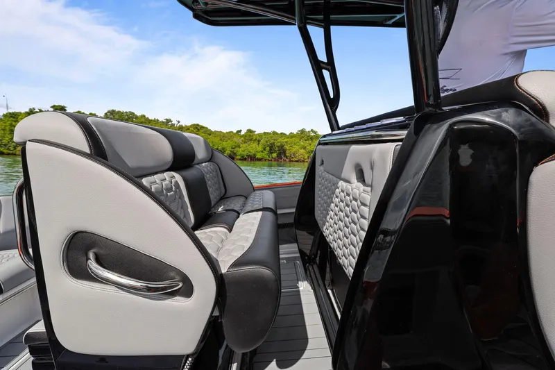 Slide: The Image of 2026 Nor-Tech 390 Sport Center Console interior with luxurious seating and sleek design. - 39