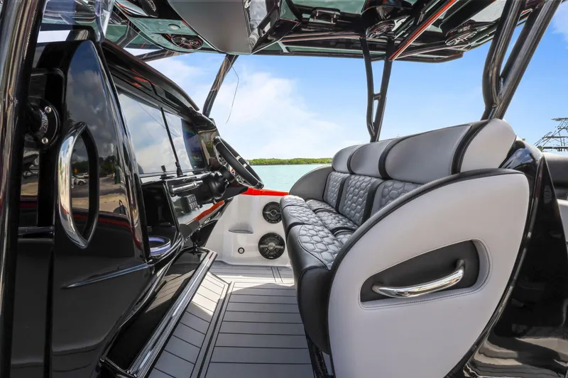 Slide: The Image of 2026 Nor-Tech 390 Sport Center Console interior with luxurious seating and sleek design. - 40