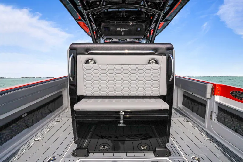 Slide: The Image of 2026 Nor-Tech 390 Sport Center Console boat interior with stylish seating and ocean view. - 41