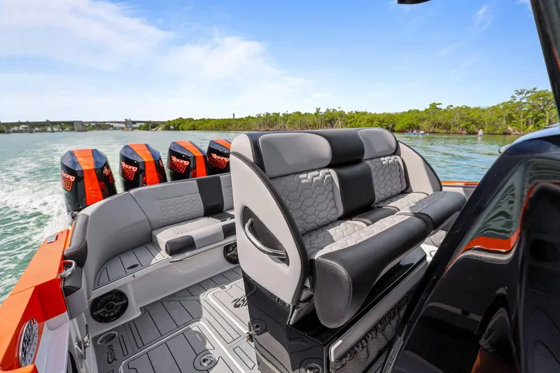 Slide: The Image of 2026 Nor-Tech 390 Sport Center Console with quad engines, sleek seating, and modern design. - 47