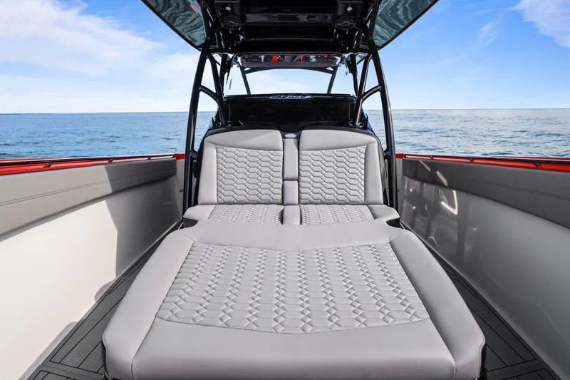 Slide: The Image of 2026 Nor-Tech 390 Sport Center Console with luxurious seating, ocean view backdrop. - 50