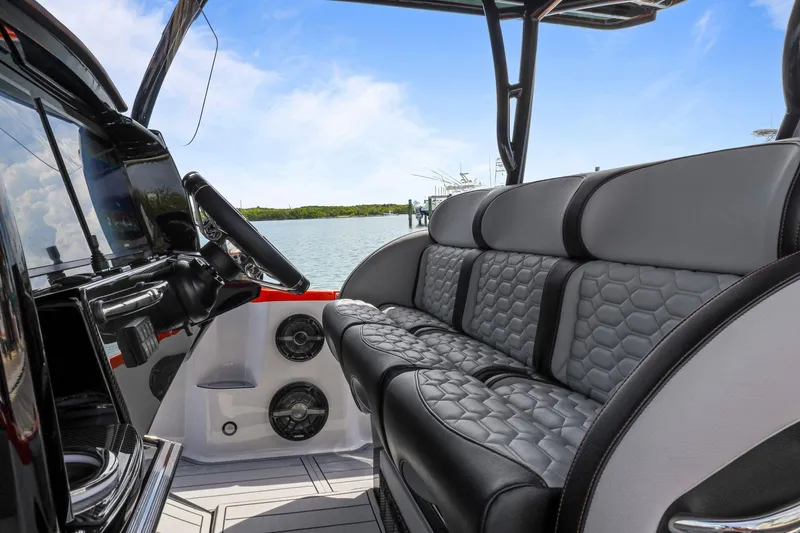 Slide: The Image of 2026 Nor-Tech 390 Sport Center Console interior with luxurious seating and modern dashboard. - 51