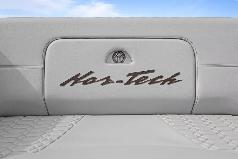Slide: The Image of 2026 Nor-Tech 390 Sport Center Console interior with logo on quilted upholstery. - 53