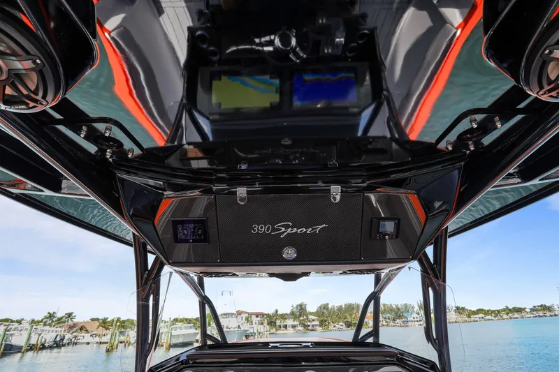 Slide: The Image of 2026 Nor-Tech 390 Sport Center Console dashboard with advanced navigation system. - 55