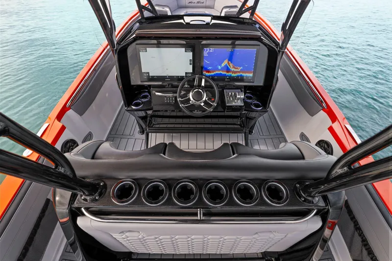 Slide: The Image of 2026 Nor-Tech 390 Sport Center Console helm with advanced navigation displays and sleek design. - 56
