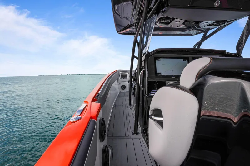 Slide: The Image of 2026 Nor-Tech 390 Sport Center Console on open water, featuring sleek design and advanced navigation. - 58