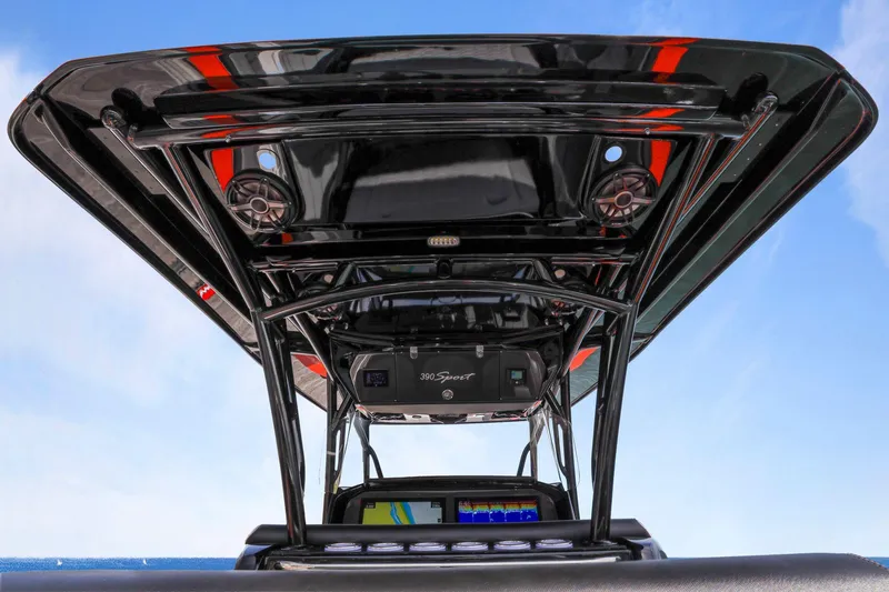 Slide: The Image of 2026 Nor-Tech 390 Sport Center Console boat with advanced navigation system and sleek design. - 60