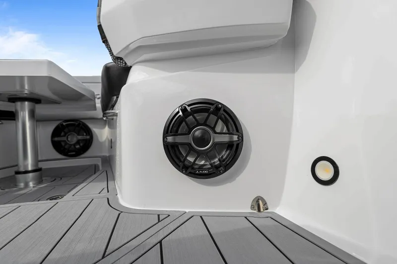 Slide: The Image of 2026 Nor-Tech 390 Sport Center Console boat interior with speakers and sleek design. - 62