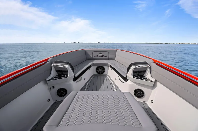 Slide: The Image of 2026 Nor-Tech 390 Sport Center Console boat interior with sleek seating and ocean view. - 67