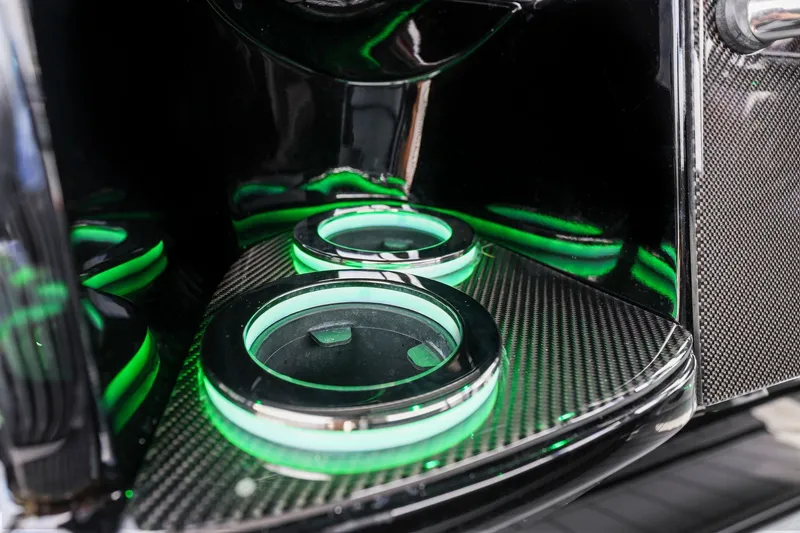 Slide: The Image of Illuminated cup holders in 2026 Nor-Tech 390 Sport Center Console boat interior. - 72