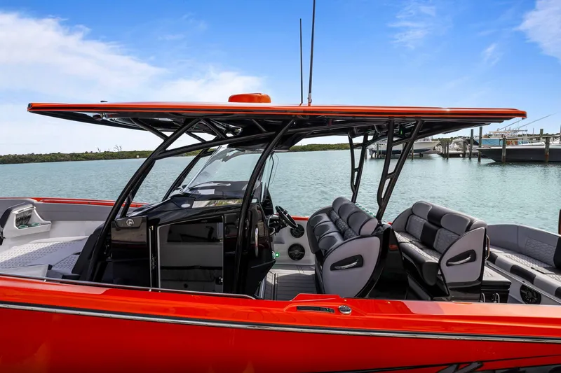 Slide: The Image of 2026 Nor-Tech 390 Sport Center Console boat with sleek design and luxurious seating. - 75