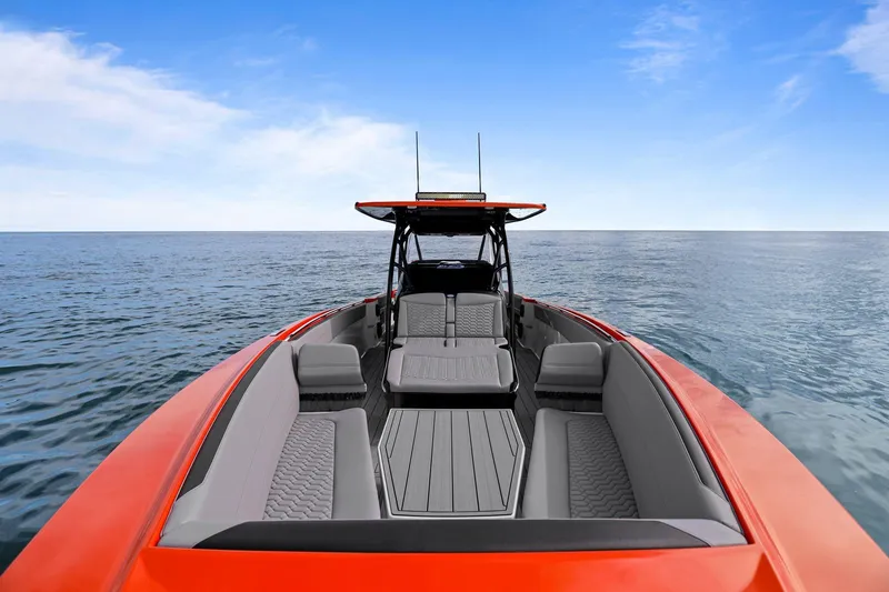 Slide: The Image of 2026 Nor-Tech 390 Sport Center Console boat on open water, featuring sleek design and spacious seating. - 78