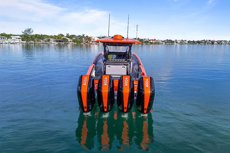 Slide: The Image of 2026 Nor-Tech 390 Sport Center Console with quad 400R engines on calm water. - 9