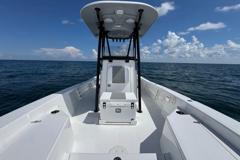 Slide: The Image of Open storage compartment on 2026 BlackJack 256 Bay boat, featuring a clean, white interior. - 11