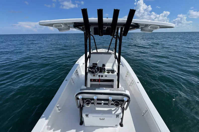Slide: The Image of 2026 BlackJack 256 Bay boat interior with sleek white finish and rod holders. - 24