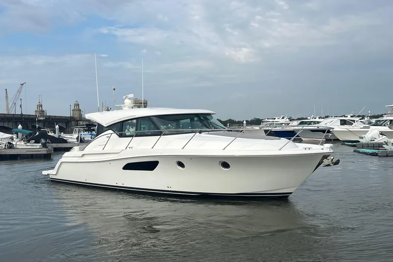 The Image of 2023 Tiara Yachts C44 Coupe in marina, showcasing sleek design and modern features. - 0