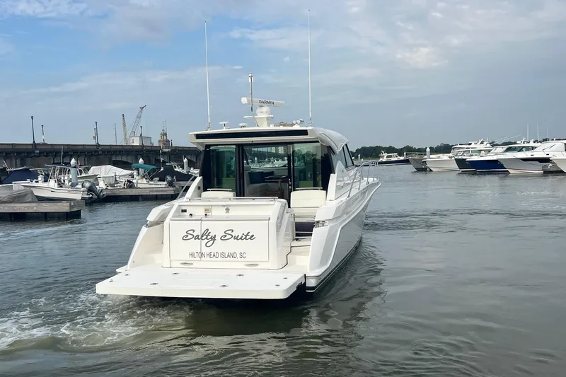 Slide: The Image of 2023 Tiara Yachts C44 Coupe "Salty Suite" at Hilton Head Island marina. - 16
