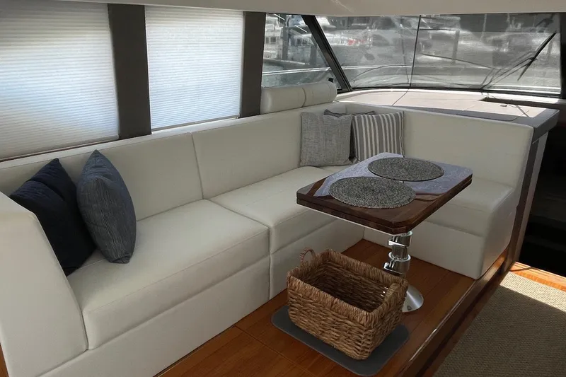 Slide: The Image of Luxurious interior of 2023 Tiara Yachts C44 Coupe with elegant seating and table. - 31
