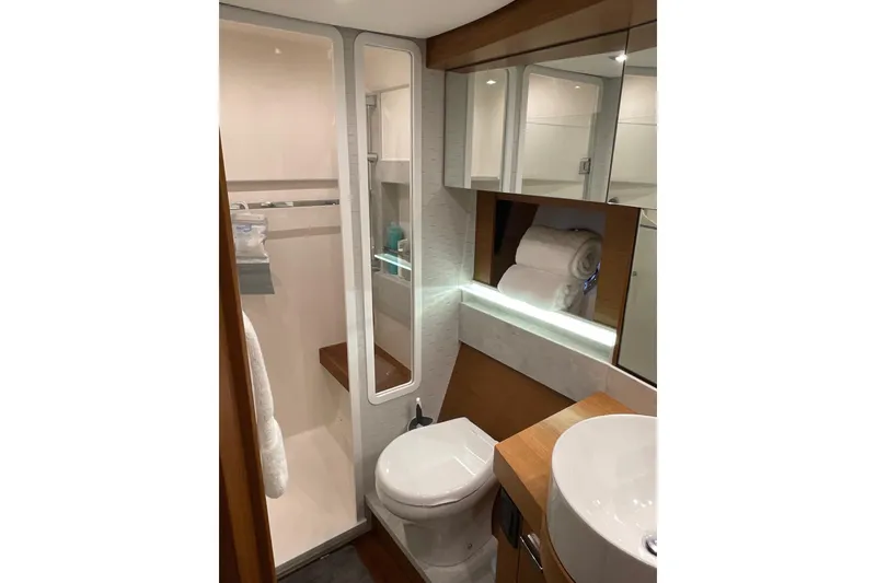 Slide: The Image of Luxurious bathroom in 2023 Tiara Yachts C44 Coupe, featuring modern fixtures and elegant design. - 37