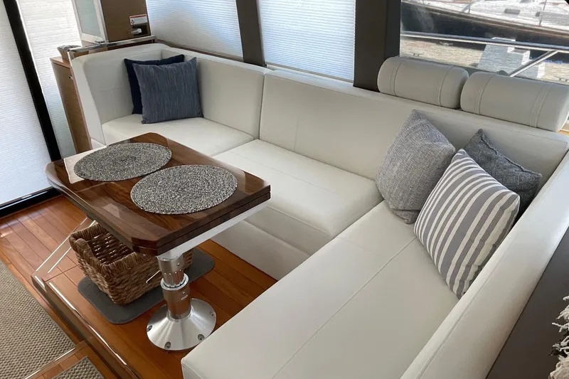 Slide: The Image of Luxurious interior of 2023 Tiara Yachts C44 Coupe with elegant seating and wooden table. - 39
