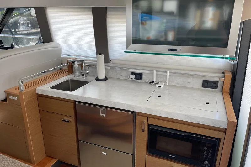 Slide: The Image of Modern kitchen area in 2023 Tiara Yachts C44 Coupe with sleek appliances. - 41