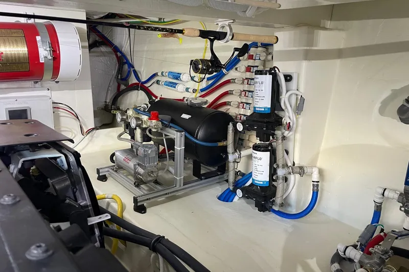 Slide: The Image of Engine room of 2023 Tiara Yachts C44 Coupe, showcasing mechanical systems and components. - 49