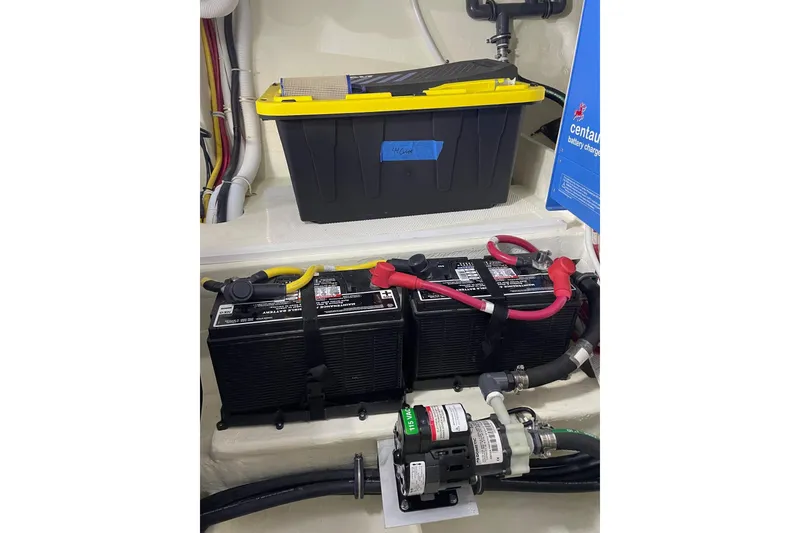 Slide: The Image of Electrical system of 2023 Tiara Yachts C44 Coupe, featuring batteries and wiring components. - 57