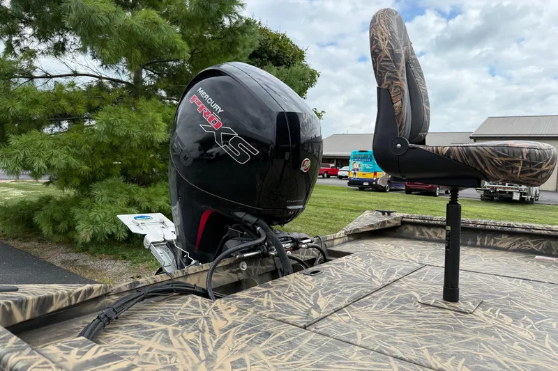 Slide: The Image of 2023 Lowe Roughneck 2070SC boat with Mercury Pro XS engine and camo seat. - 16