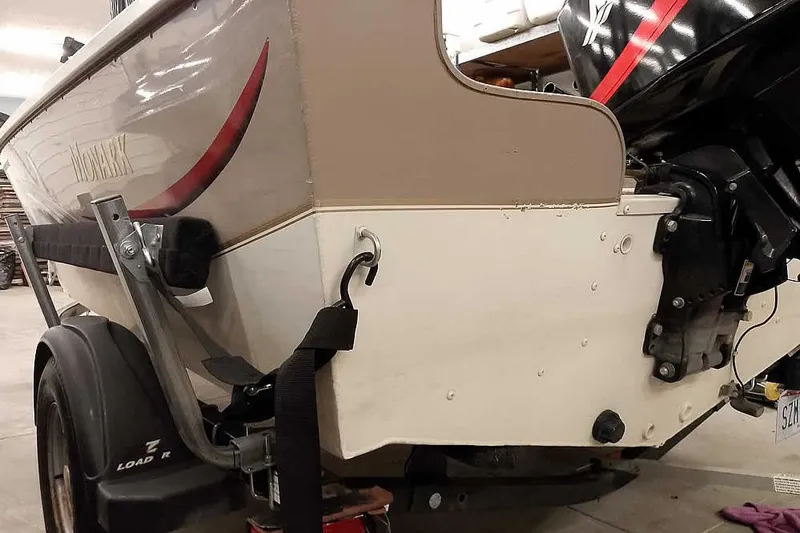 Slide: The Image of 2005 Monark Signature 1601 boat on trailer, rear view with motor. - 11