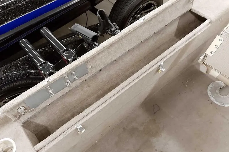 Slide: The Image of Interior view of a 2005 Monark Signature 1601 boat storage compartment. - 16