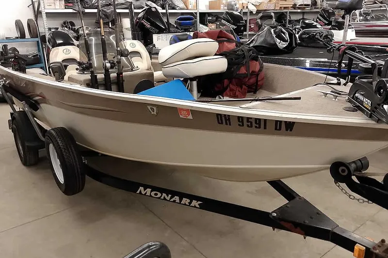 Slide: The Image of 2005 Monark Signature 1601 fishing boat on trailer in storage. - 24