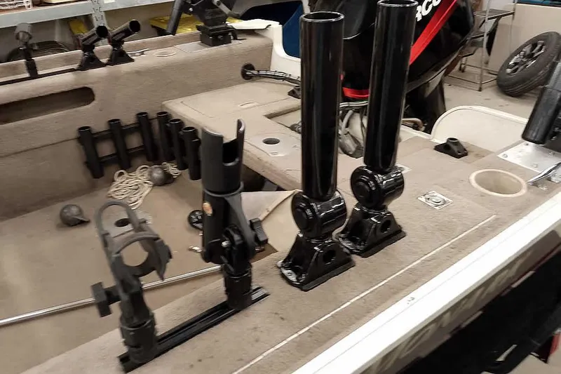 Slide: The Image of 2005 Monark Signature 1601 boat interior with fishing rod holders and equipment. - 9