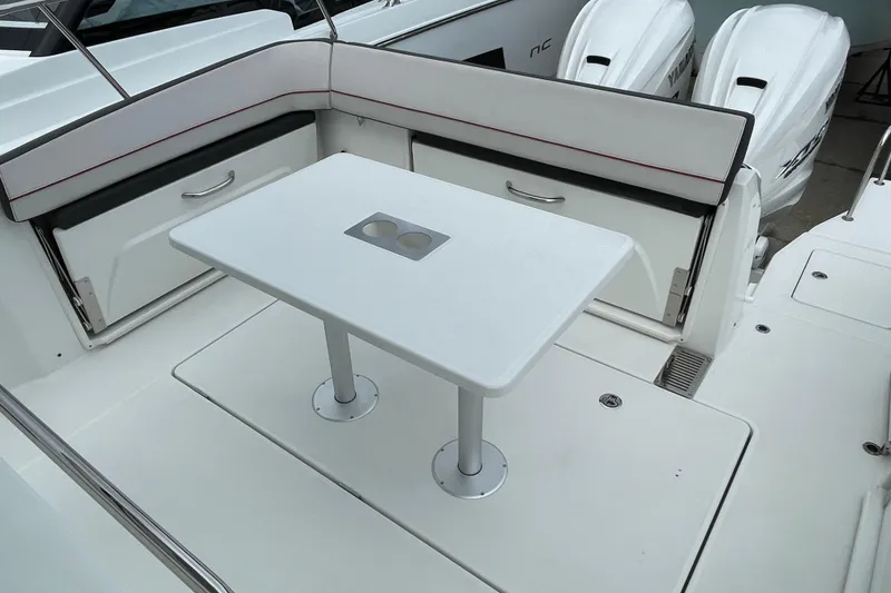 Slide: The Image of 2024 Jeanneau Leader 10.5 CC cabin entrance with wooden stairs and door. - 10