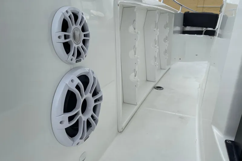 Slide: The Image of 2024 Jeanneau Leader 10.5 CC boat interior with seating and table. - 14